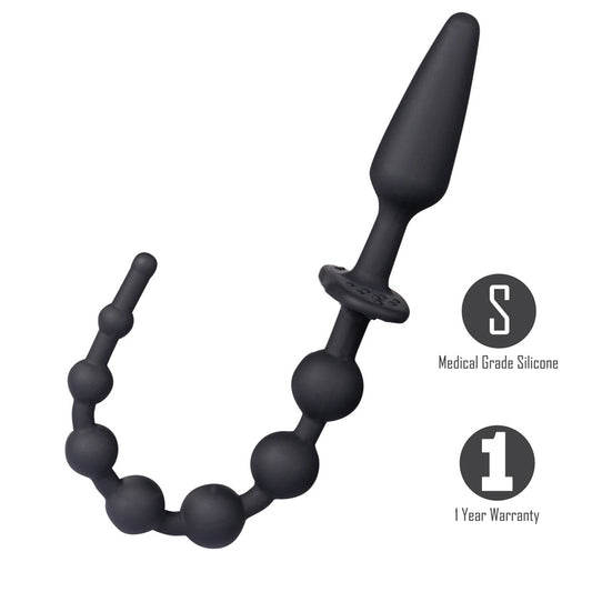 Black silicone anal plug and bead strand with a dual use flared base laid out on a neutral background.